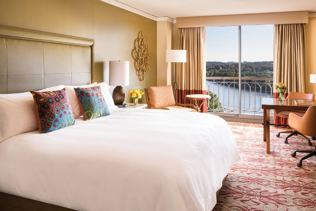 A view of the interior of one of the Four Seasons Austin's rooms looking out to Lady Bird Lake