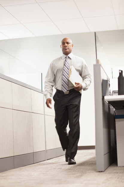 Professional man walking in an office