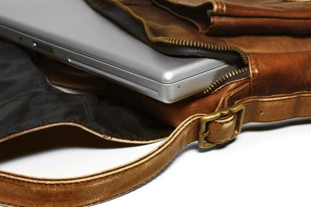 Close up of a laptop in a leather laptop bag 