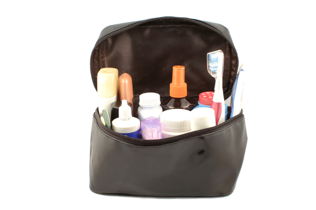 A toiletry bag with different travel-sized products in it