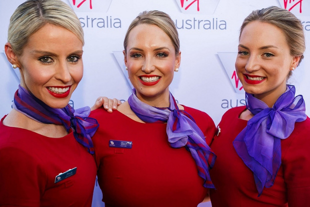 A close up of three flight attendants in Virgin Australia uniforms