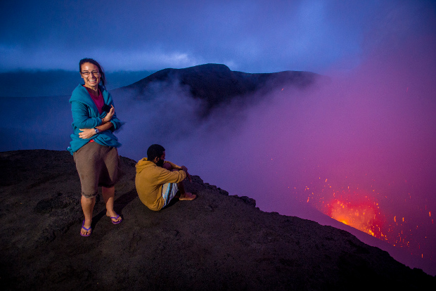 Tourists stand on the lip of Vanuatu's Mt Yasur volcano.