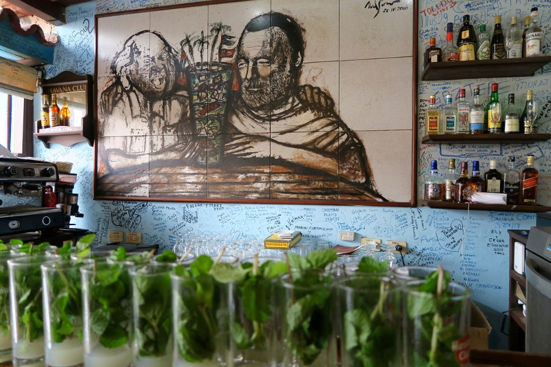A striking artwork dominates one wall of a cafe in Cuba.