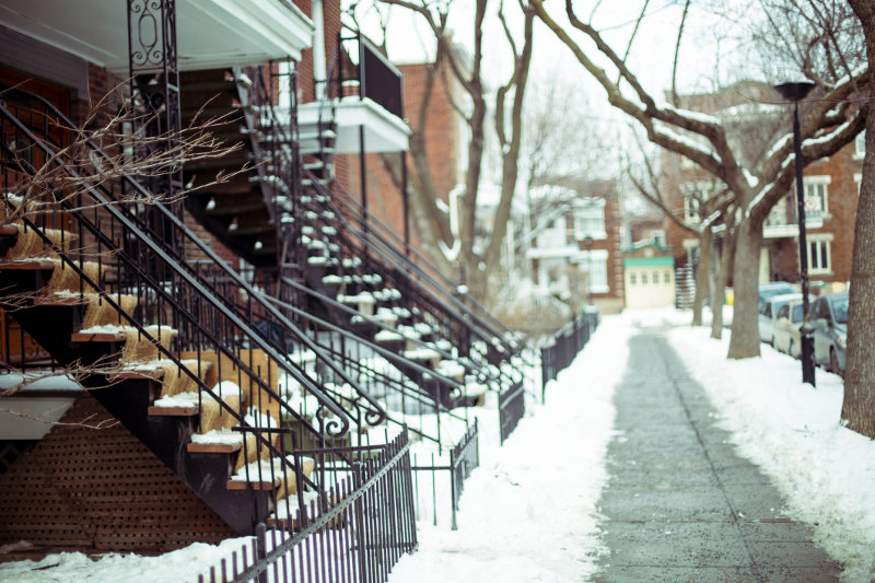 Staircases of Montreal's terrace houses are covered in snow.