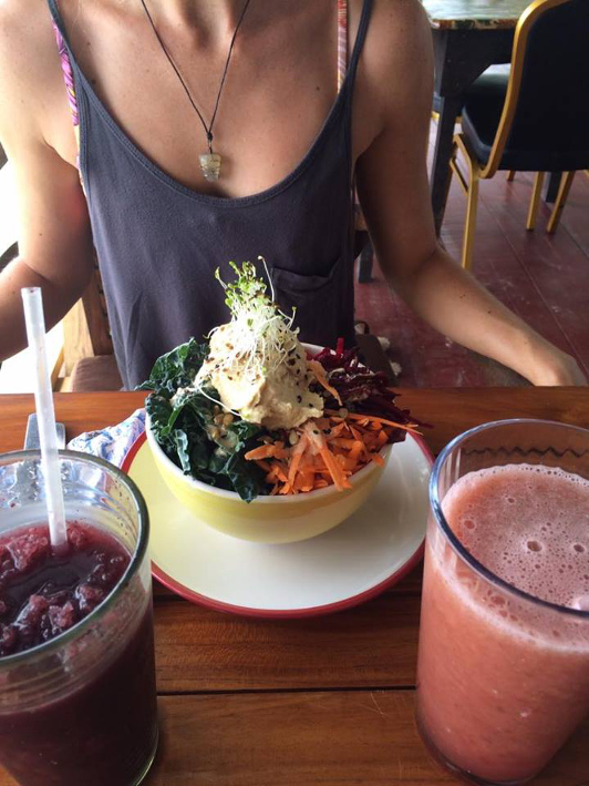 A woman enjoys fresh salads and juices at a cafe in Panama.
