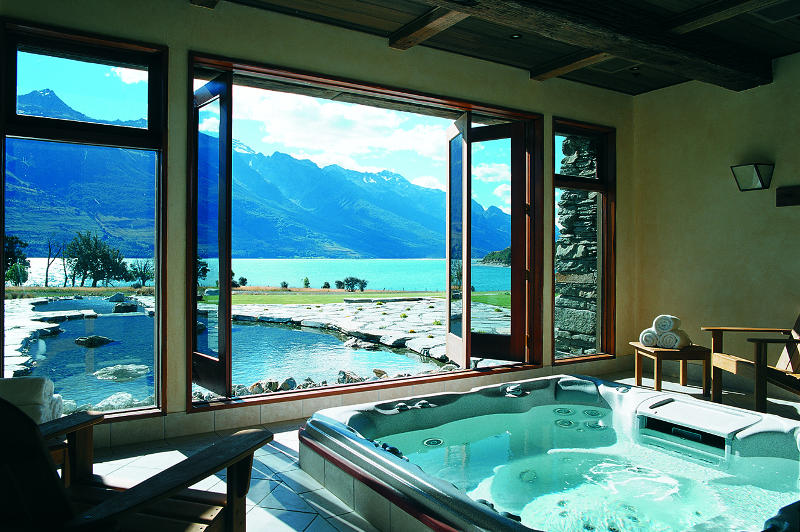 spa overlooking lake at blanket bay lodge new zealand