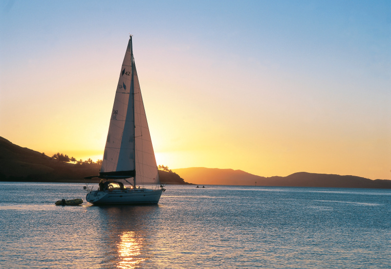 Yacht sails in Dent passage, just off Hamilton Island, Queensland, Australia