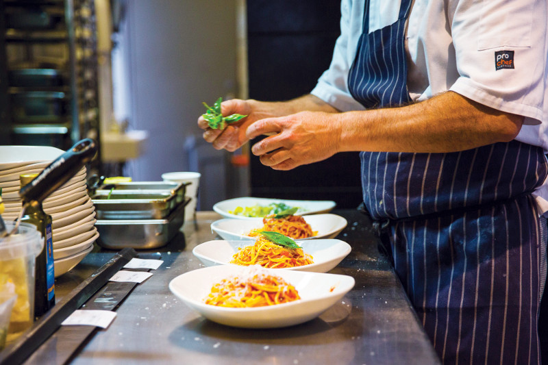 plating up italian dishes in lygon street melbourne