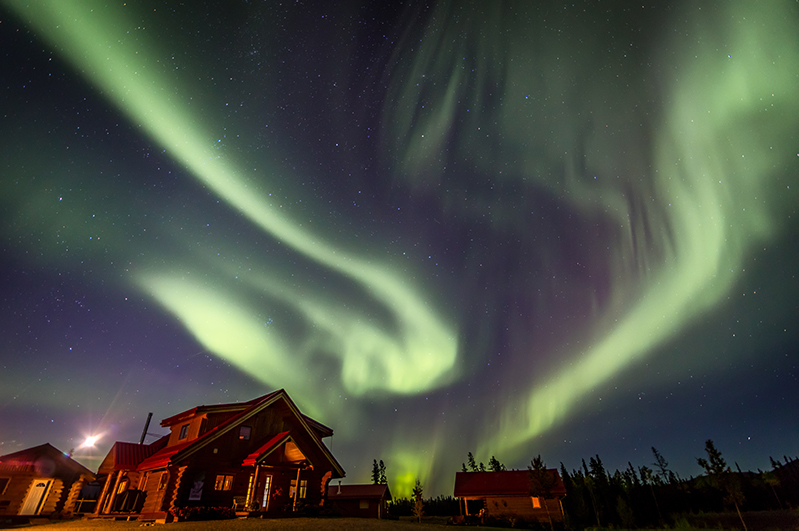 Northern lights above the Northern Lights Resort & Spa, YT