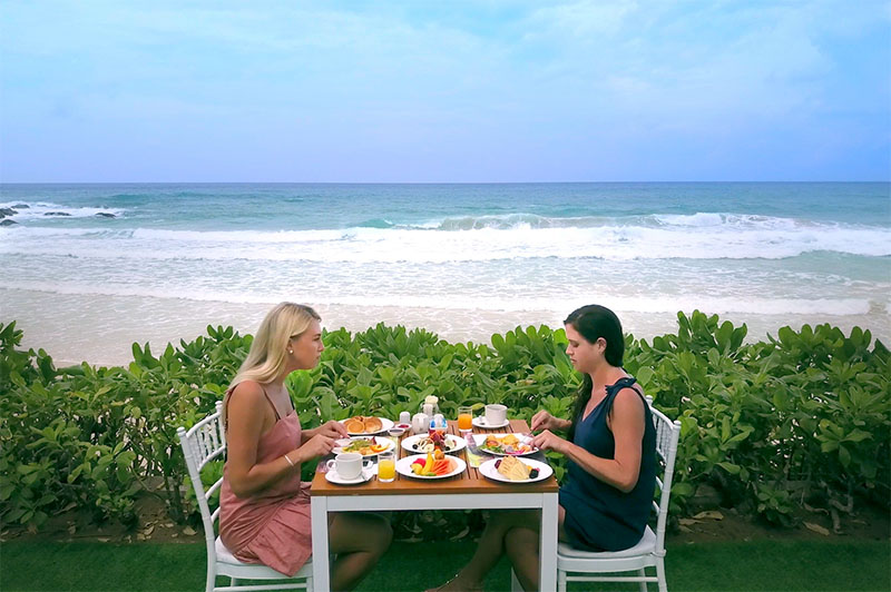 greer and rhi at a private beachfront breakfast