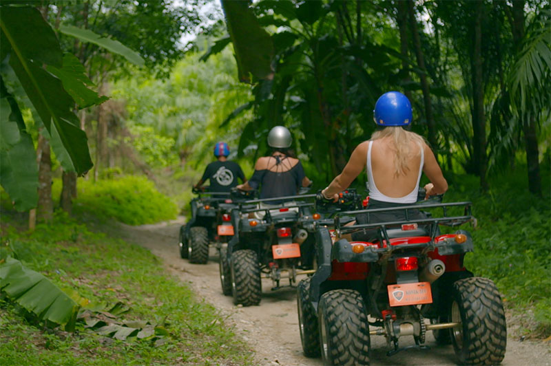 greer and rhiannon on quad bikes in the jungle