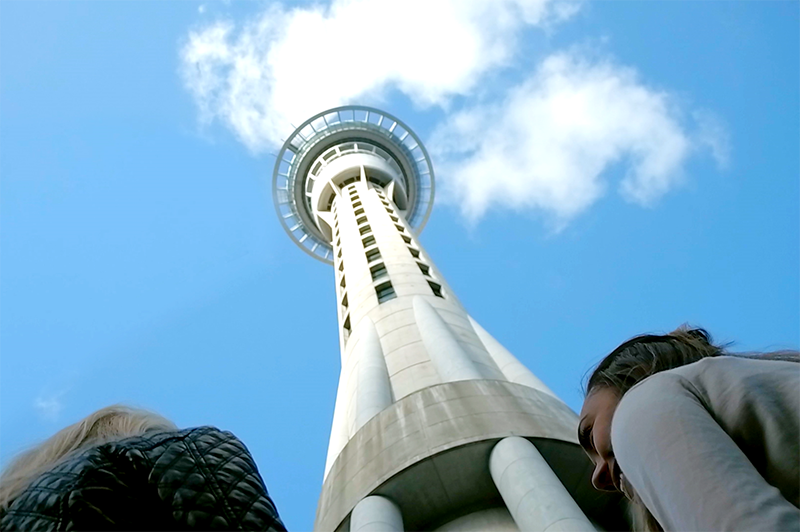 greer looks up at auckland sky tower