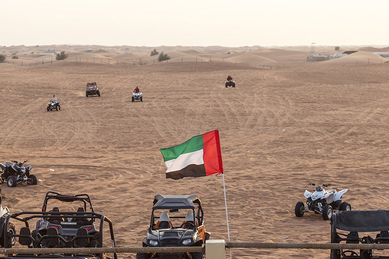 dune buggy in sand dunes near abu dhabi