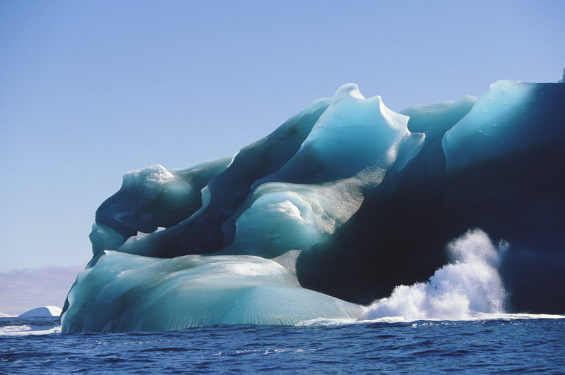 Waves crash against an iceberg in the Drake Passage. Image: Getty