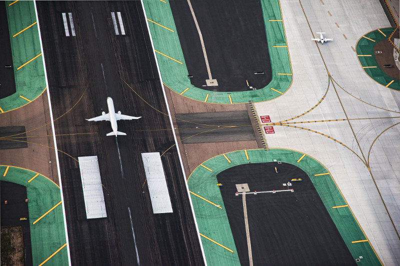 Planes on the tarmac, viewed from above.