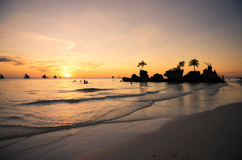 A golden sunset on the island of Boracay in the Philippines.