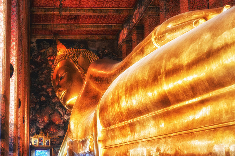 A view of the golden reclining Buddha at Wat Pho in Bangkok, Thailand.