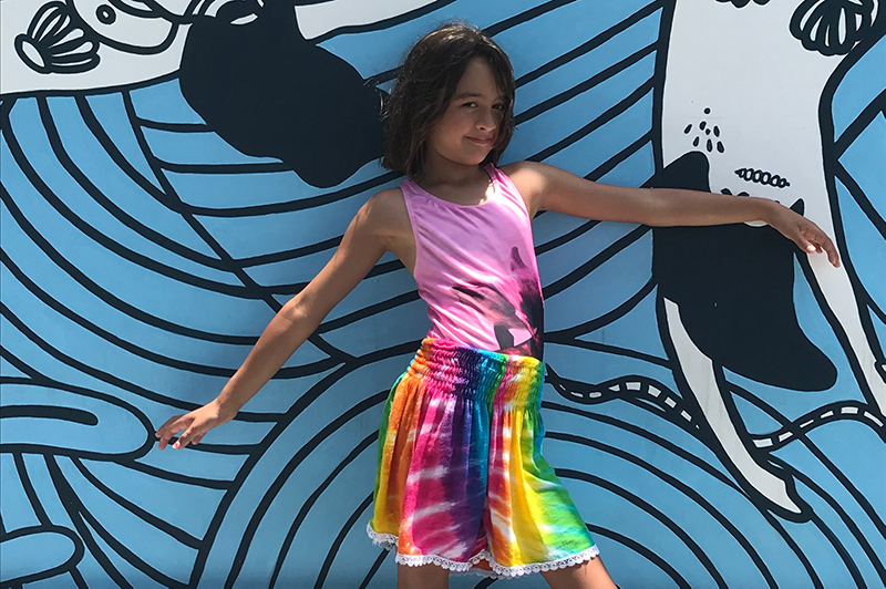 Girl in front of mural in Canggu.