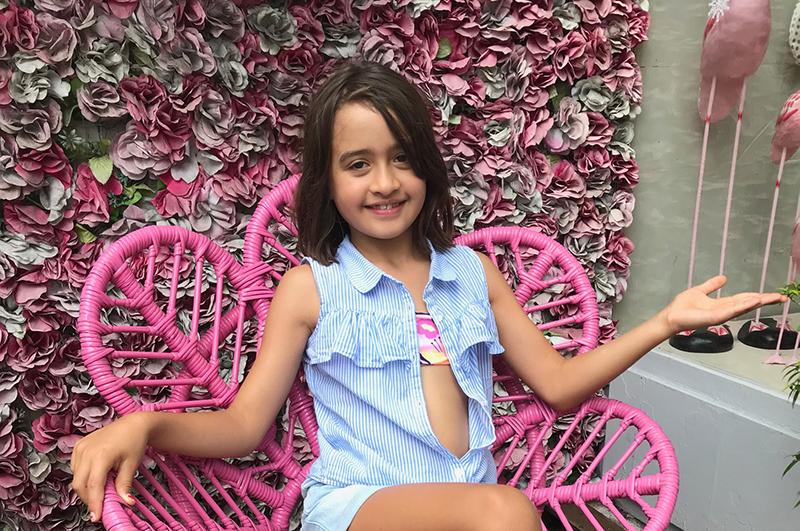 Girl in chair in front of Seminyak shop