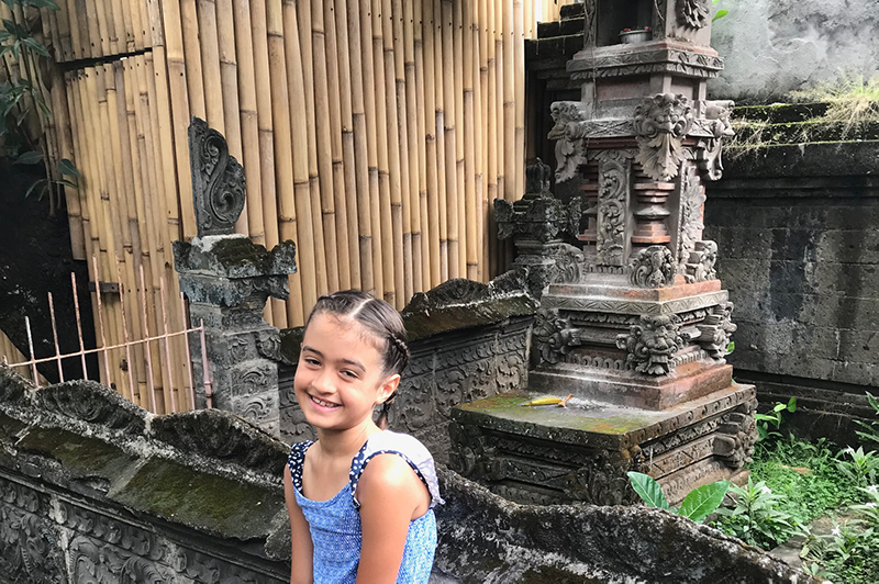 Girl in front of Bali shrine