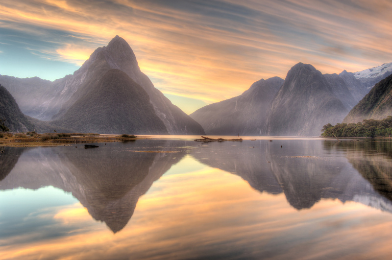 Morning casts pastel reflections in Milford Sound.