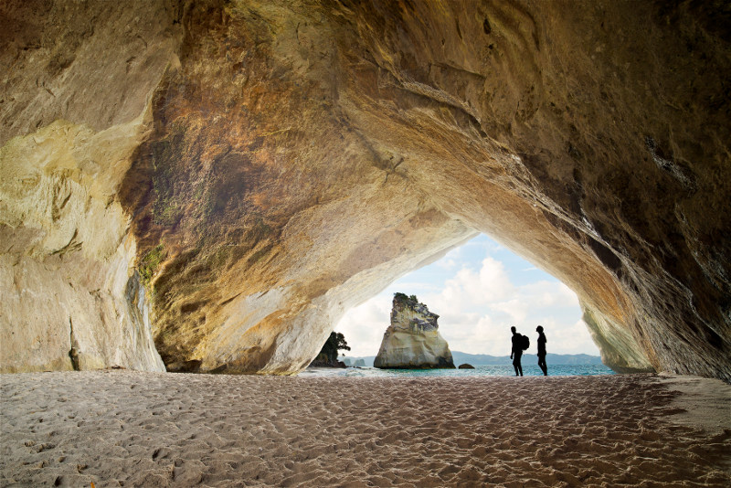 Couple standing in Cove, Coromandel Peninsula, New Zealand