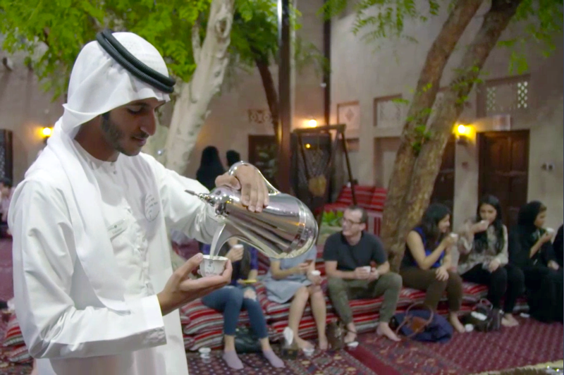 Arab man pouring tea