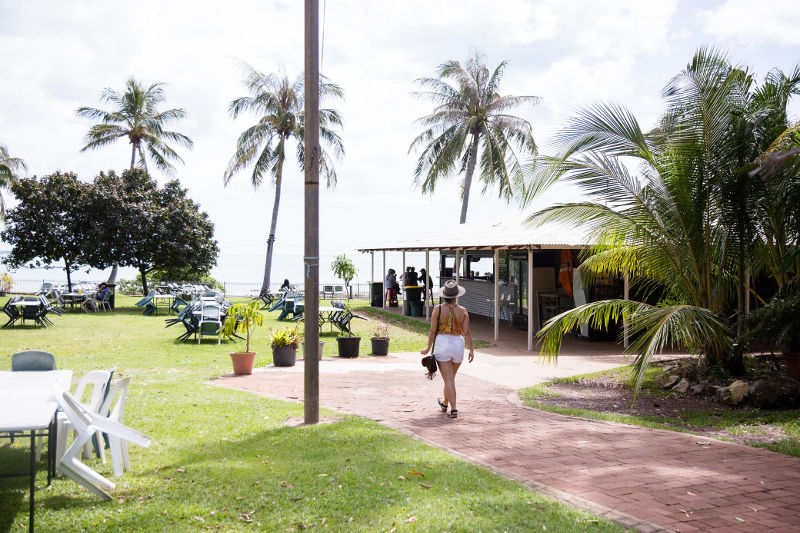 Girl walking into Darwin Ski club with alfresco seating