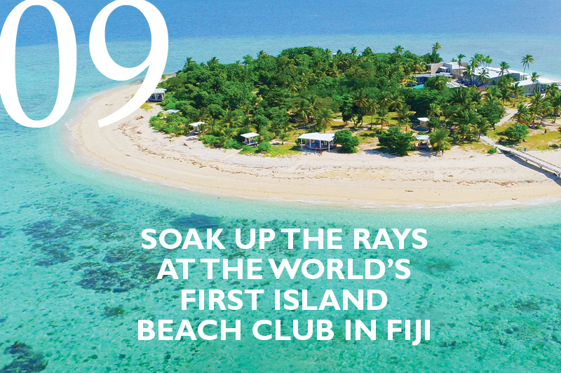 aerial shot of the island beach club in fiji