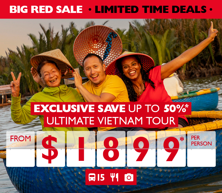 Exclusive save up to 50%* ultimate Vietnam tour from $1,899* per person. Three people in a rowboat in Vietnam posing for a picture
