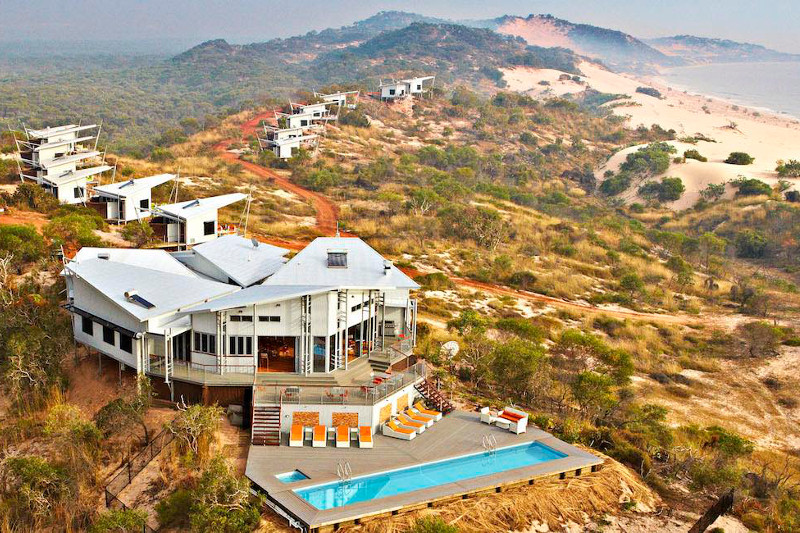Aerial view of Berkeley River Lodge, nestled among coastal dunes on Western Australia's northern coast.