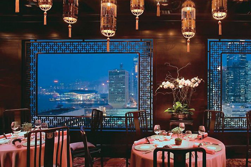 Beautiful interior and windows looking out onto Hong Kong skyline.