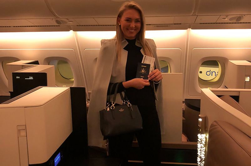 A female stands in Business Class Cabin on Etihad Airways