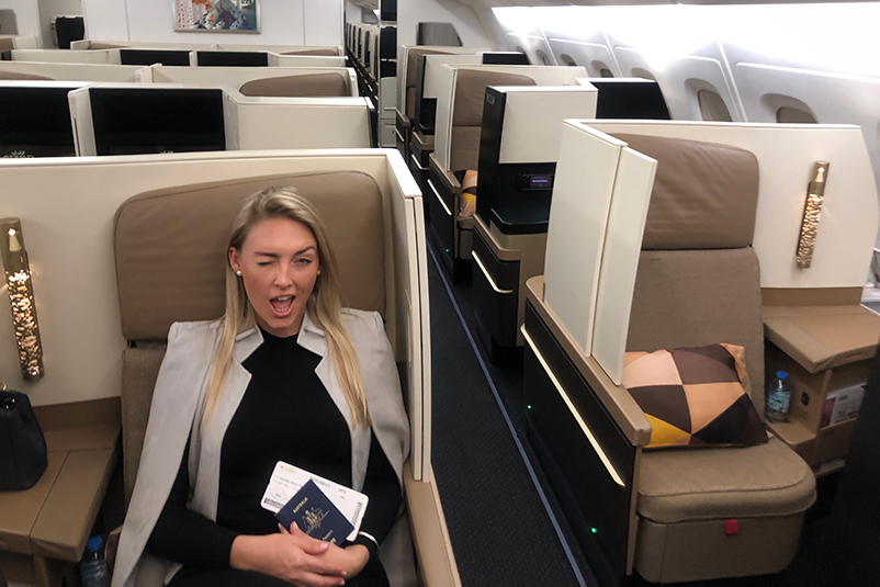 Female winking on a plane