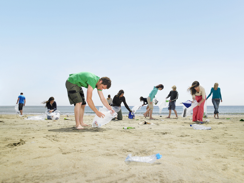 people collecting rubbish on Cornwall beach