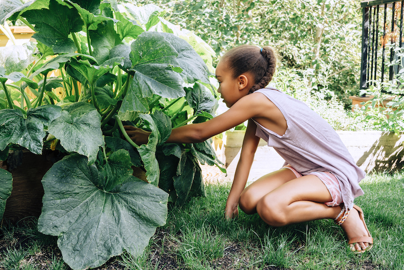 young girl in garden