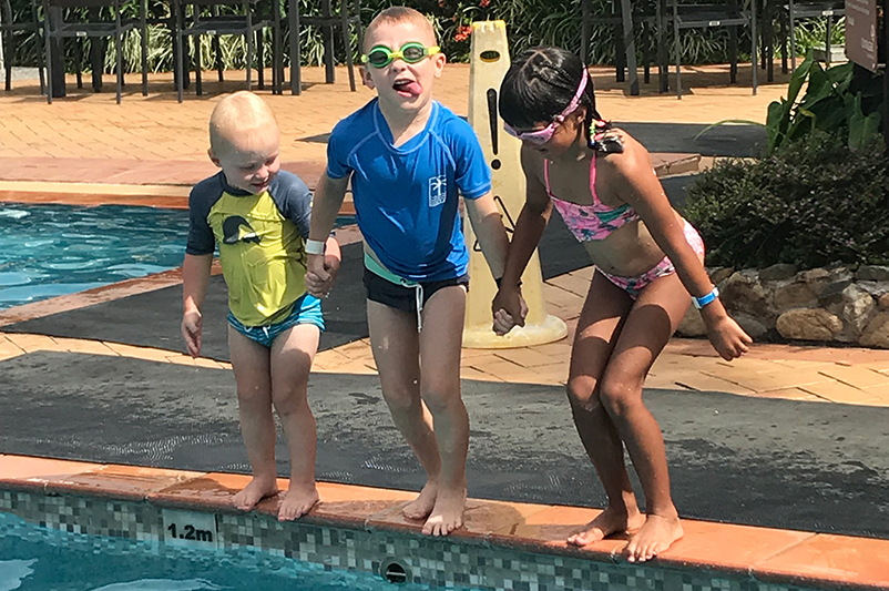 Kids at Outrigger Fiji Beach Resort pool
