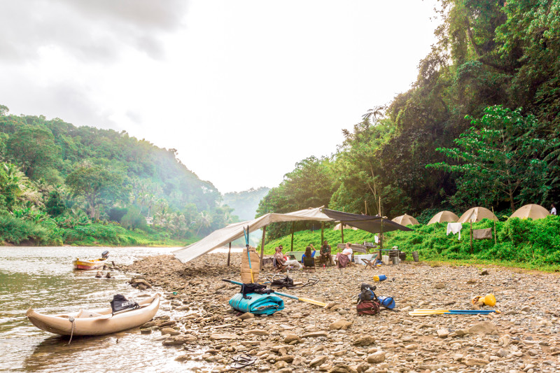 A basic camp set up along the banks of a river