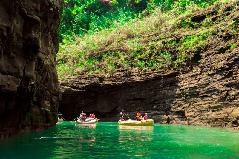Two boats floating on the Navua River