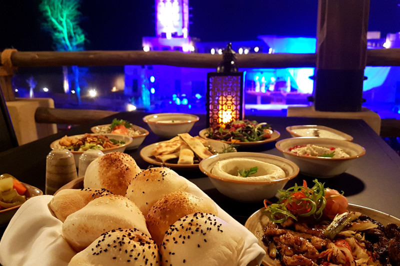 Food at restaurant with show in background