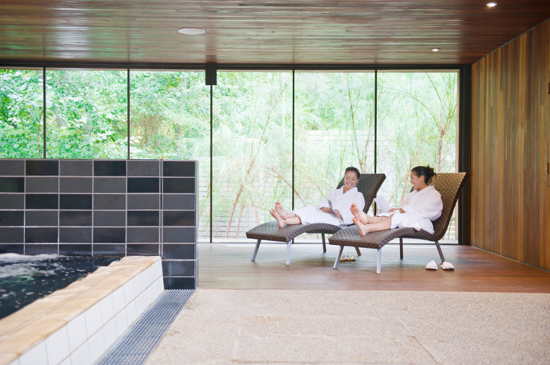 Two women relax in a spa in Daylesford, Victoria.