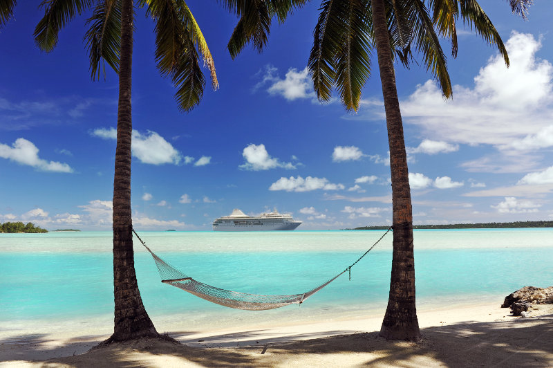 Ocean liner off shore of tropical island