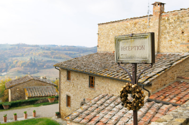 guest house sign in european countryside