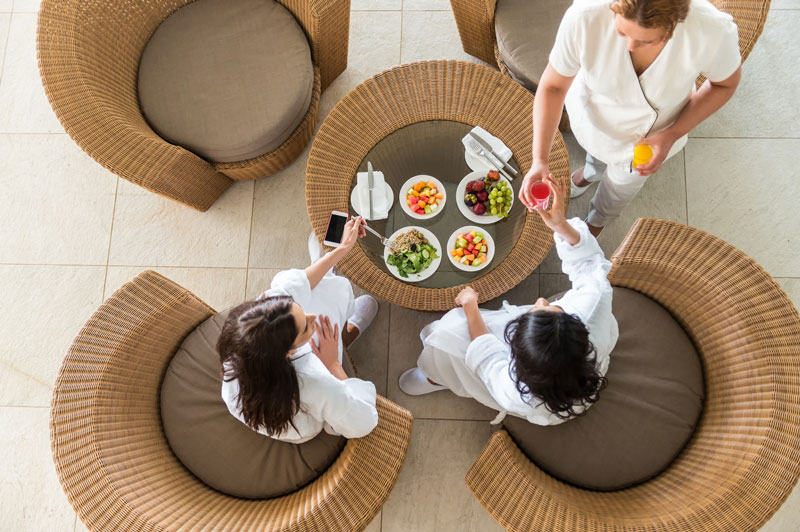 Women at spa sitting at outdoors table