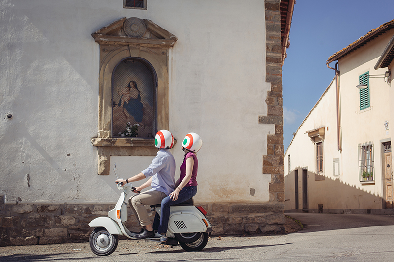 Couple on scooter in Italy