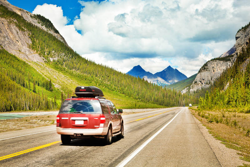 car on roadtrip through rocky moutnains