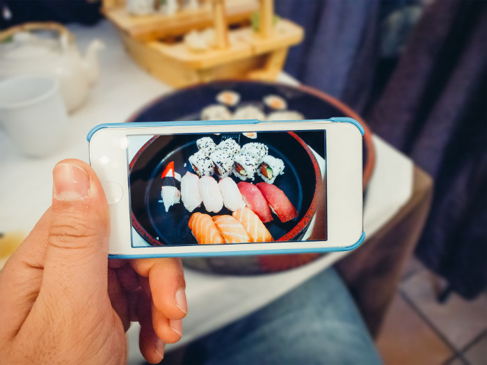 sushi plate photo through phone
