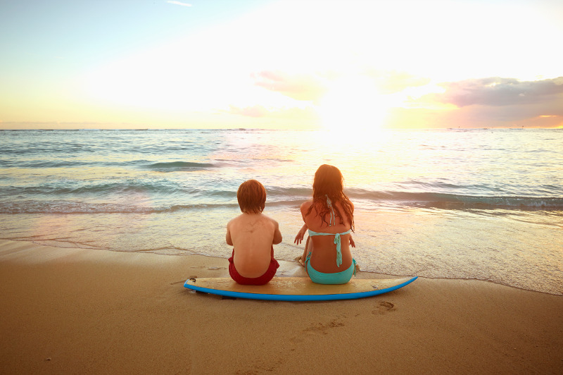 Two kids on beach in Hawaii