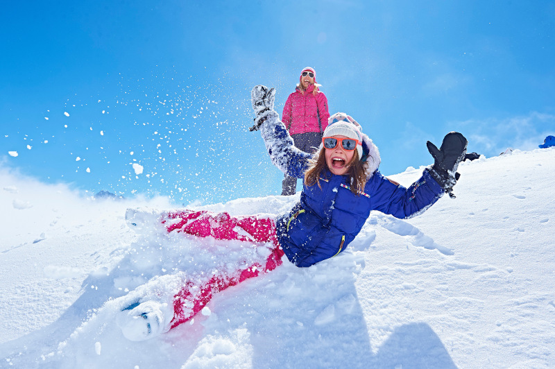 Girl having fun in the snow