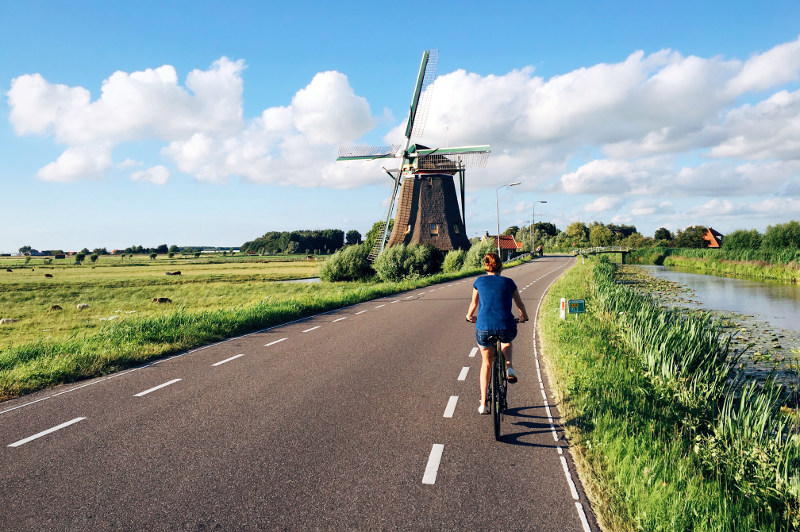 woman cycling on dutch road